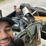 guys in front of junk removal truck