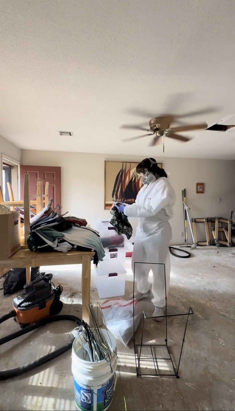 person in hazmat doing a hoarding cleanup